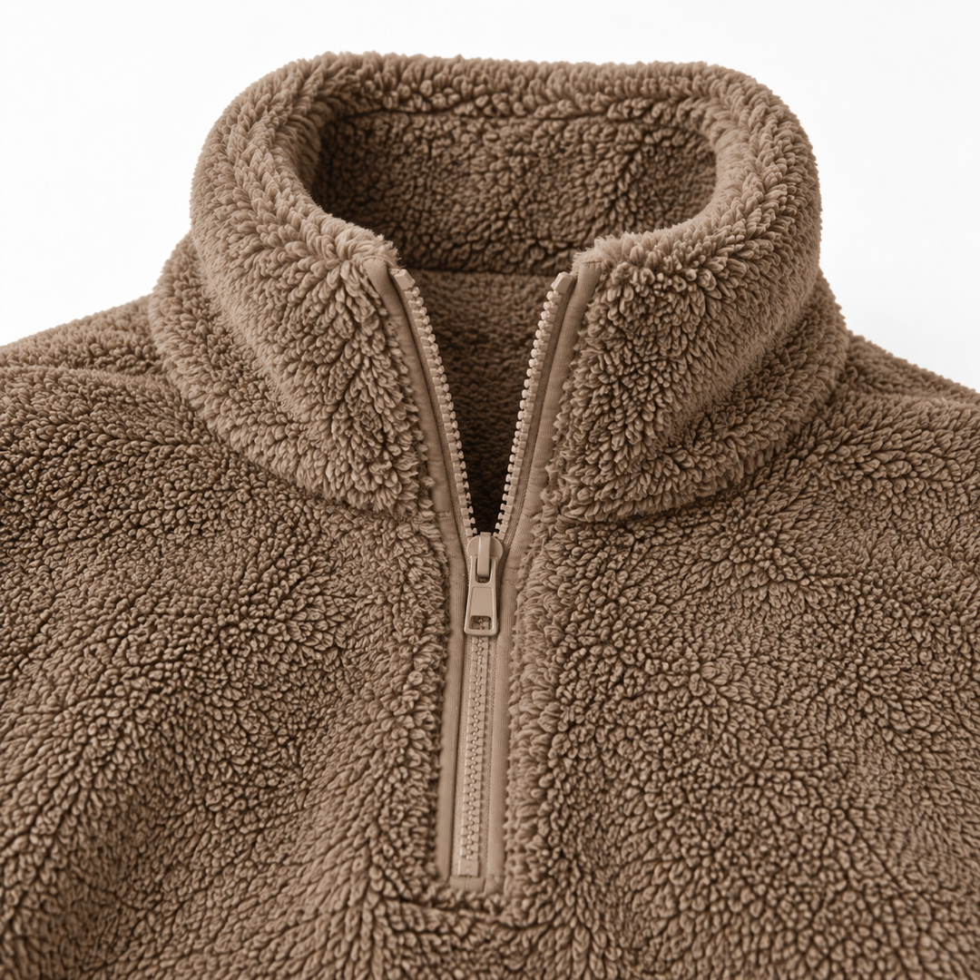 Close-up of the caramel half zip sweater stand collar and zipper, showing the verified front closure and fleece texture detail.