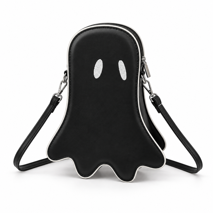 Black Halloween ghost crossbody bag front view with white eyes, contrast piping, zipper and long shoulder strap