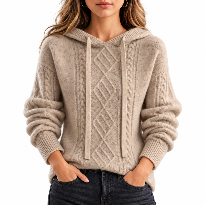Light camel hooded jacquard knit sweater on a professional model against a white background, showing front pattern and sleeves.