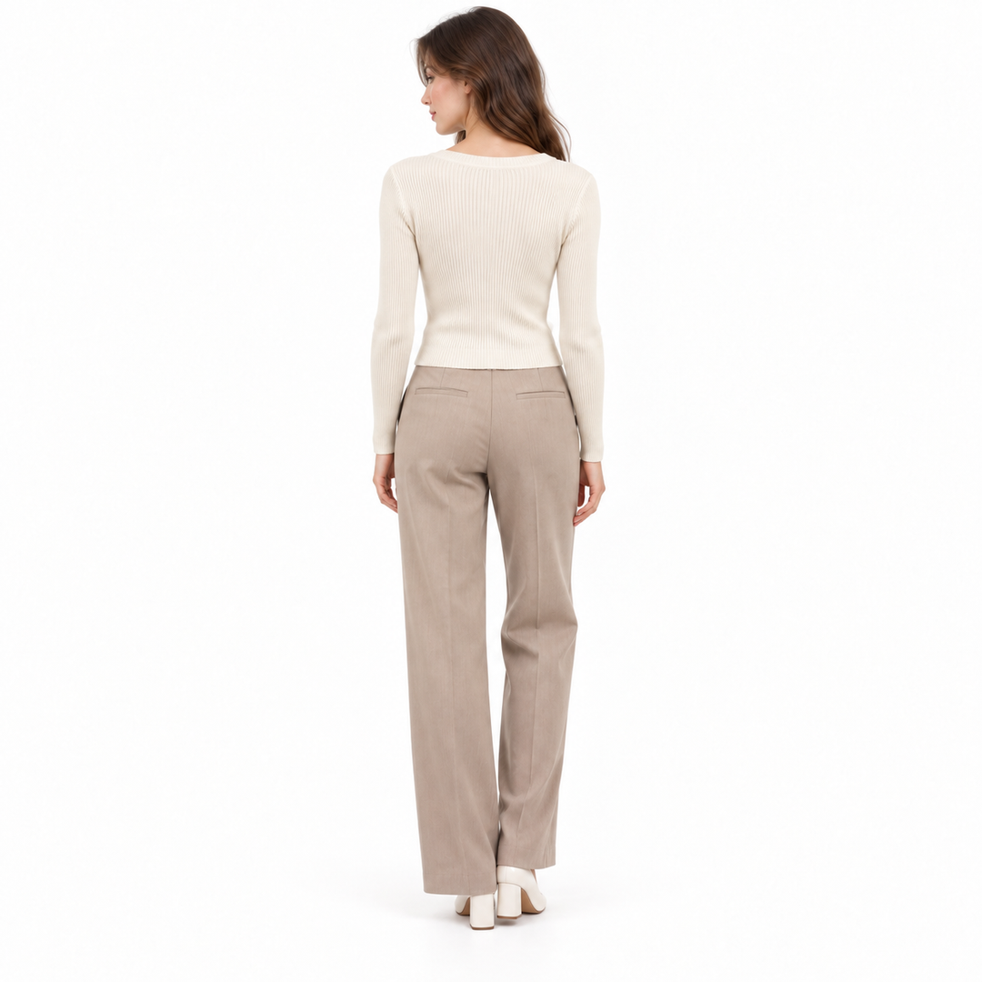 Oatmeal ribbed knit top back view showing the fitted long sleeves and clean pullover silhouette.