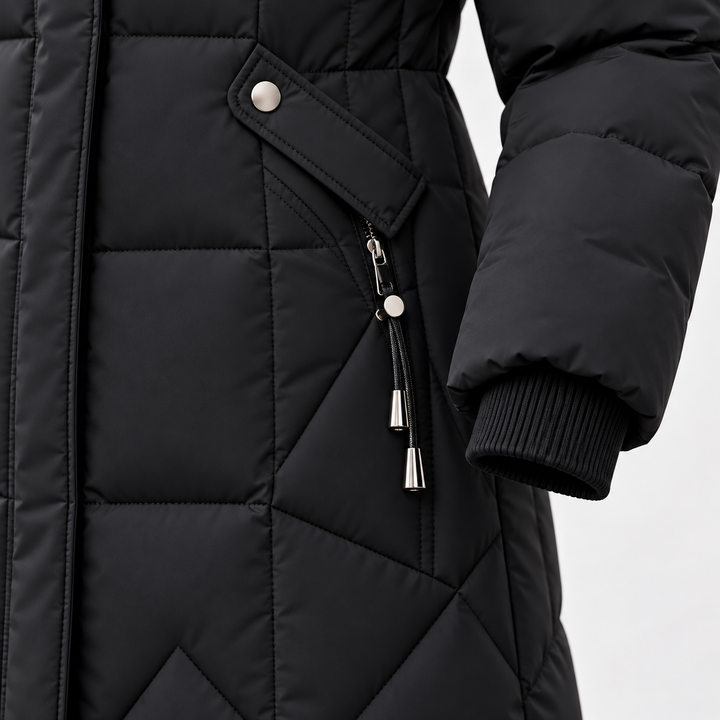 Black long puffer coat detail showing pocket, zipper, cuff and quilting