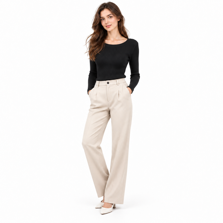 Black womens long sleeve knit top on a full-body model with light trousers for clear contrast.