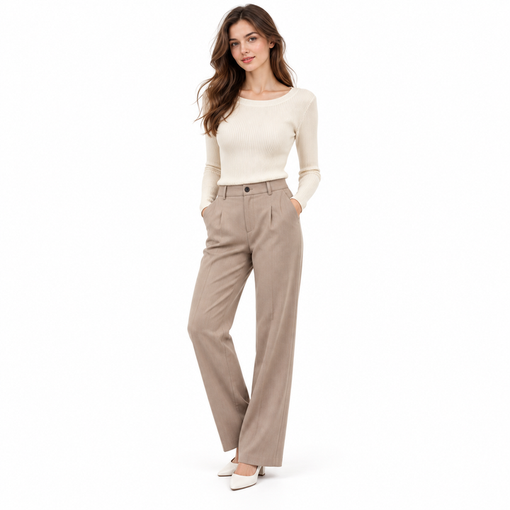 Womens long sleeve knit top in oatmeal on a full-body model, showing the ribbed slim pullover shape for layering.