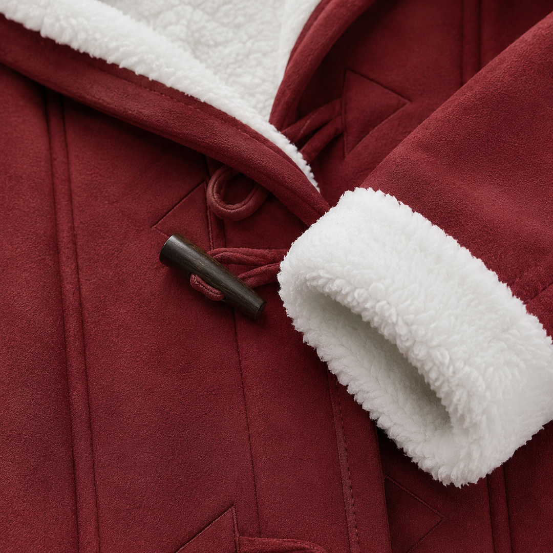 Burgundy sherpa lined toggle coat close-up highlighting the dark toggle fastening, white sherpa cuff, seam finish and hood lining
