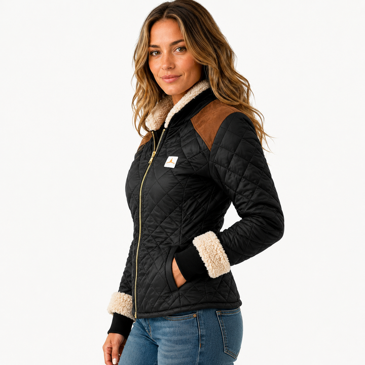 Side view of black quilted jacket on model showing black quilting, brown shoulder panels, cream trim and front zipper detail.