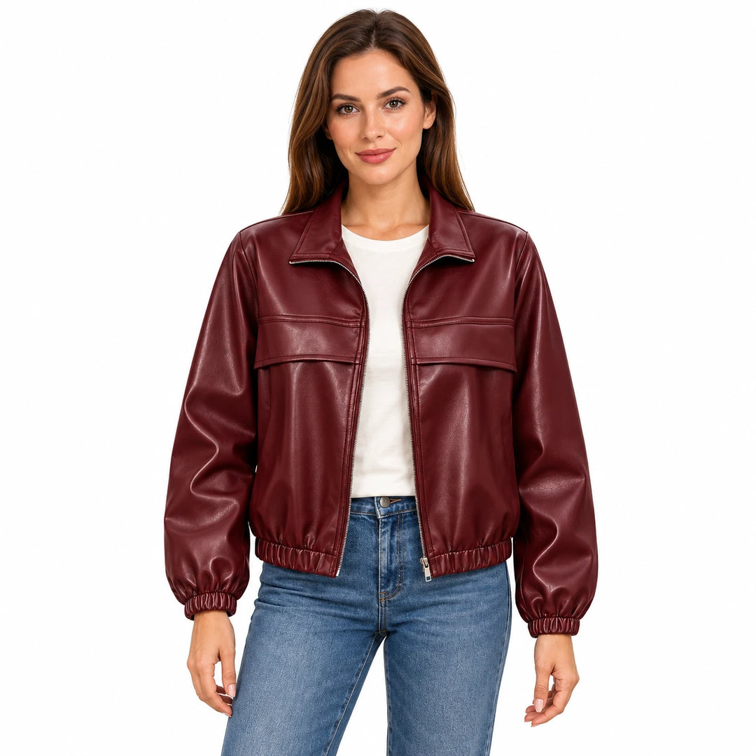 Woman wearing the Wine Red faux leather jacket with an ivory T-shirt and blue jeans on a white background.